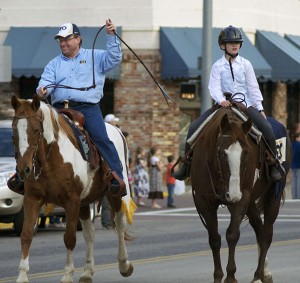 President Bob Davies & daughter Katie ride in the parade