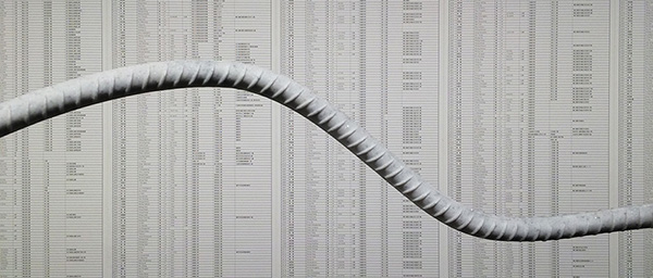 Detail from Ai Weiwei: Fault Line. Foreground: marble replicas of twisted iron rebar pulled from one of the schools that collapsed in the Sichuan Earthquake (Rebar and Case, 2014). Background: the names of the 5,196 school children killed in the 2008 Sichuan earthquake. Photograph by Ian Boyden.