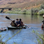 Students studying the river in a canoe