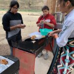Students cooking dinner at Cottonwood Crossing Summer Institute