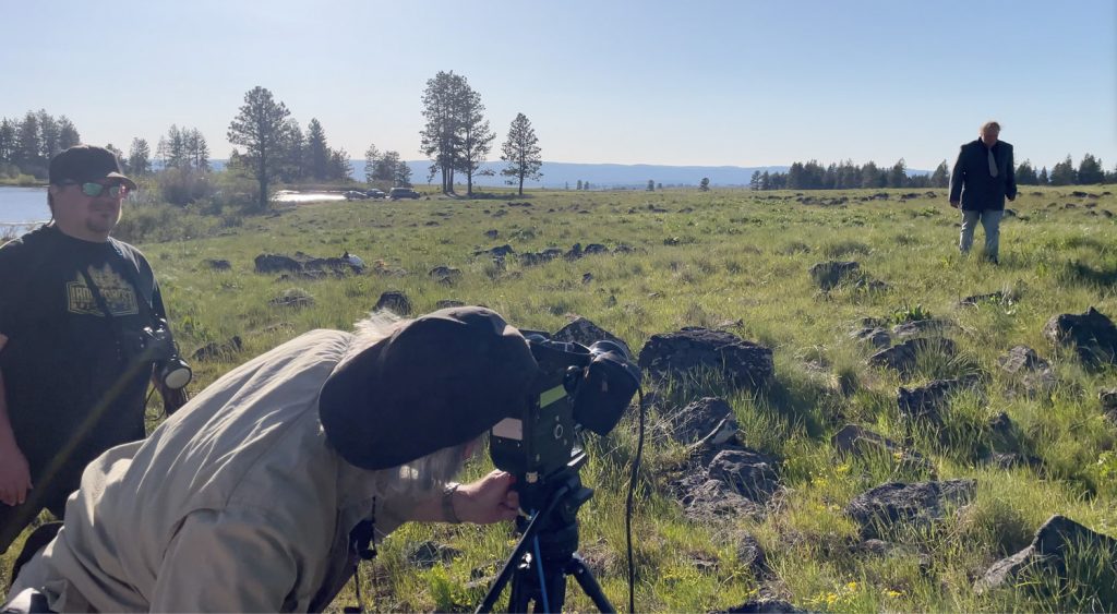Professor Roy proposes a shot composition with a Bolex 16mm film camera on The Tree with Trevor Winder (Sound Mixer) and Zen Califf (Lead Actor)
