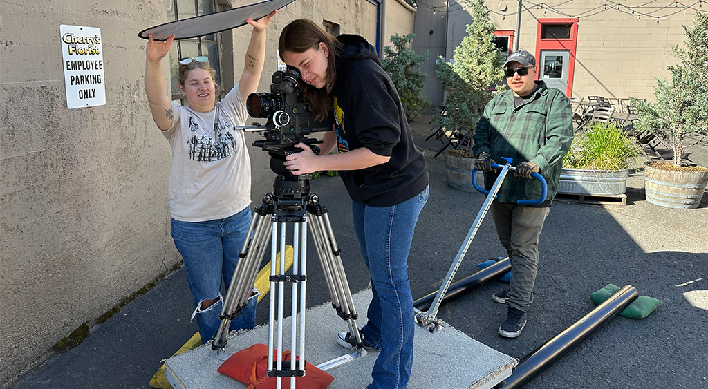 Caity blocks and composes a complicated dolly shot.  