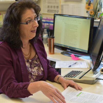 Picture of EOU Financial aid director Sandy Henry in her office