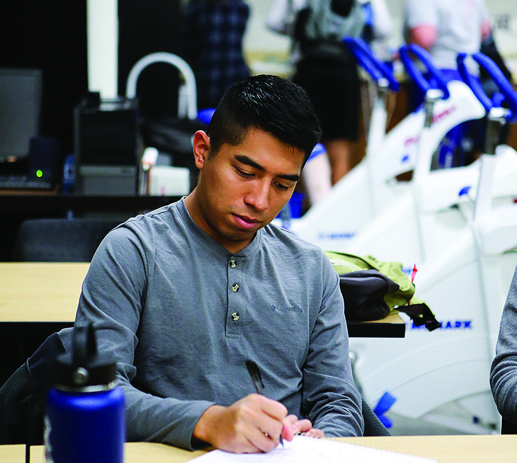 A Health and Human Performance student in class