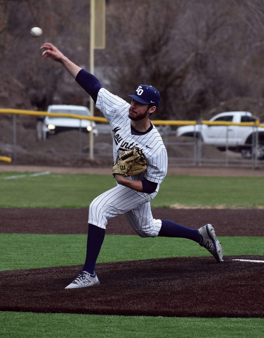 EOU Baseball pitcher throws a pitch