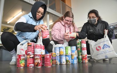 Students doing food inventory at the food drive