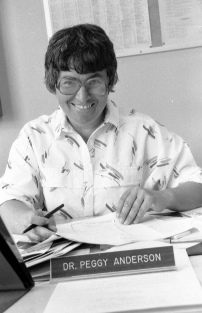 Dr. Peggy Anderson smiles at the camera in this black and white photo