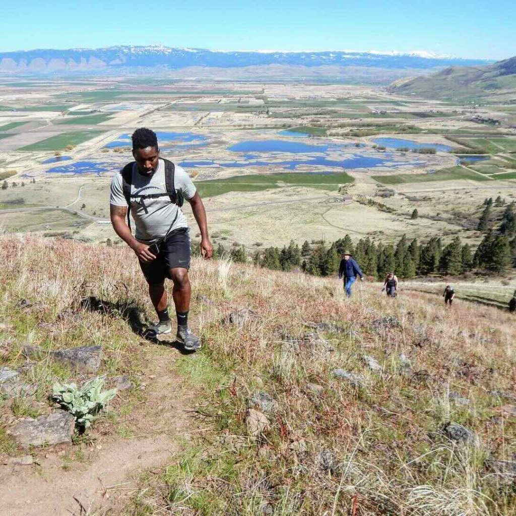 EOU student hiking up Glass Hill. 