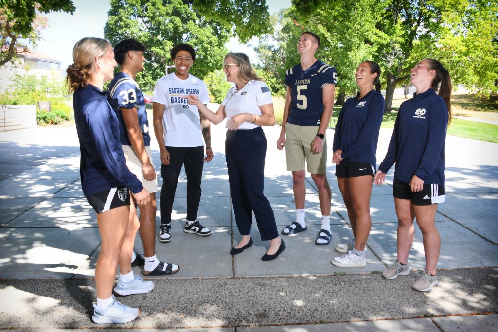 Dr. Kelly Ryan with Athletes in the Quad