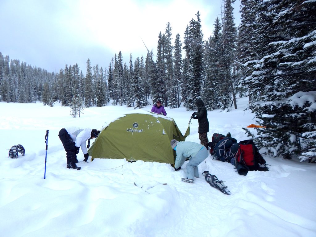 EOU students setting up their tent while winter camping during the OUT 180 Winter Camping course. 