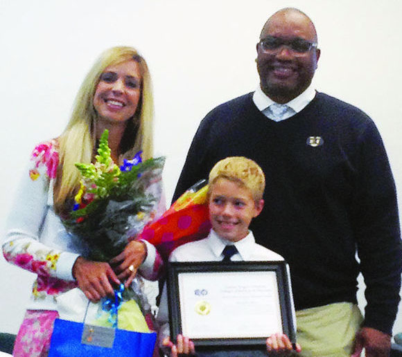 Raeschelle Meyer, director of student services at Four Rivers Community School in Ontario, also received an award. She is pictured with her son Kyle and Donald Easton-Brooks.