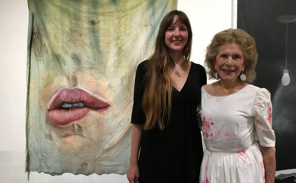 Photo courtesy of Blackfish Gallery / Erica Hitzman, left, and Lawrence Duckler's widow, Selma, stand in front of Hitzman's award-winning piece, "Spill."