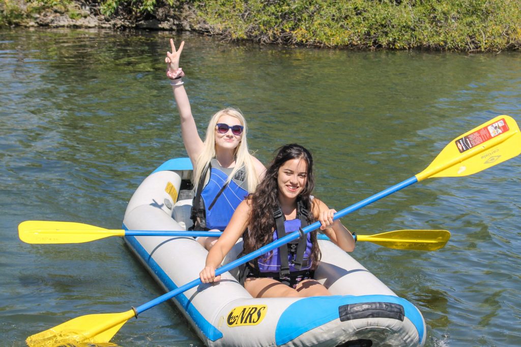 EOU students posing with their paddle boards at Wallowa Lake.