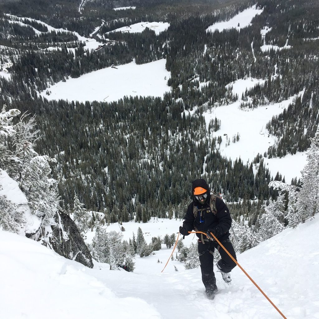 EOU student mountaineering on Gunsight Mountain.