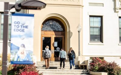 students walk into Ackerman Hall