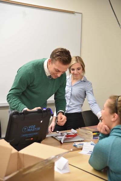 Kyle Pfaffenbach in the lab with students in 2019