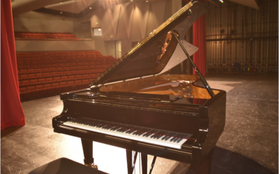 Piano on stage at McKenzie Theater
