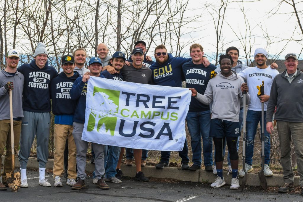 Students and faculty in a group photo during the EOU tree planting event.