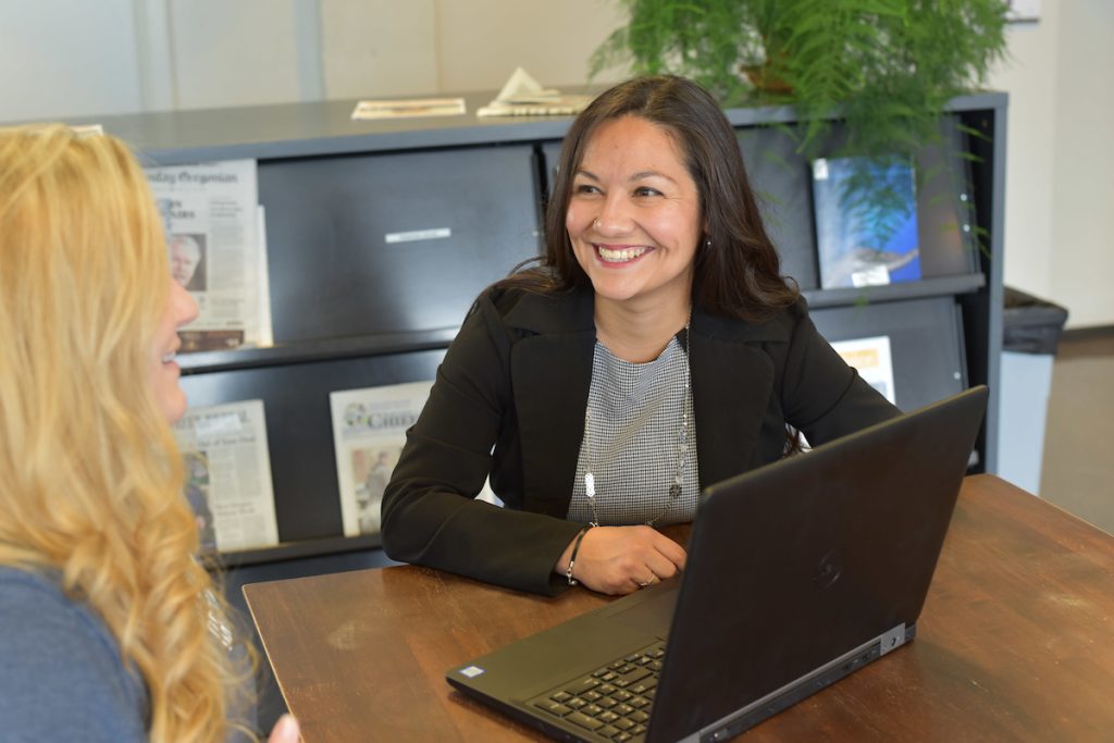 A student with a counselor at EOU