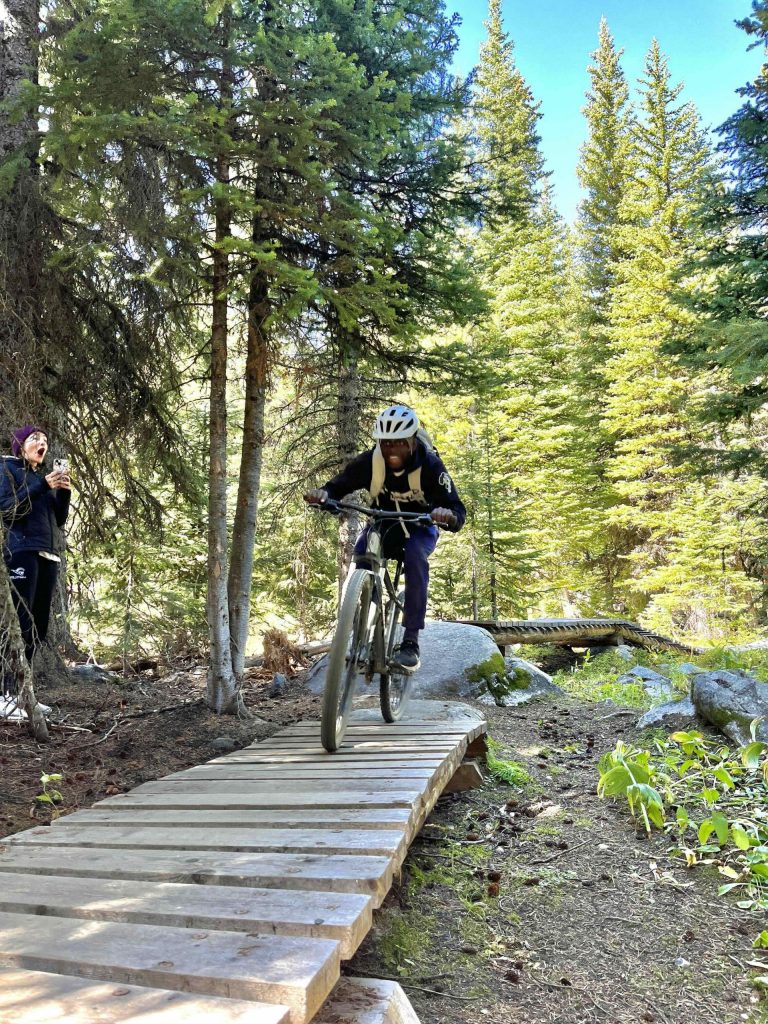 Mountain biker riding on an elevated turnpike at Anthony Lakes.