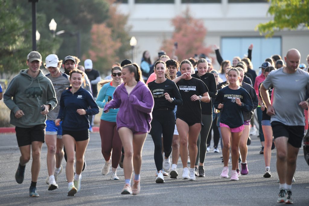 EOU Students and faculty jogging on campus