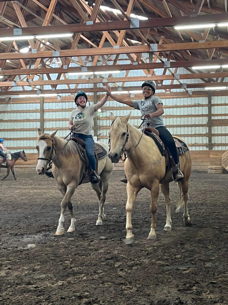 OUT 180 Beginner Horsemanship students ride horses at Victory Acres 