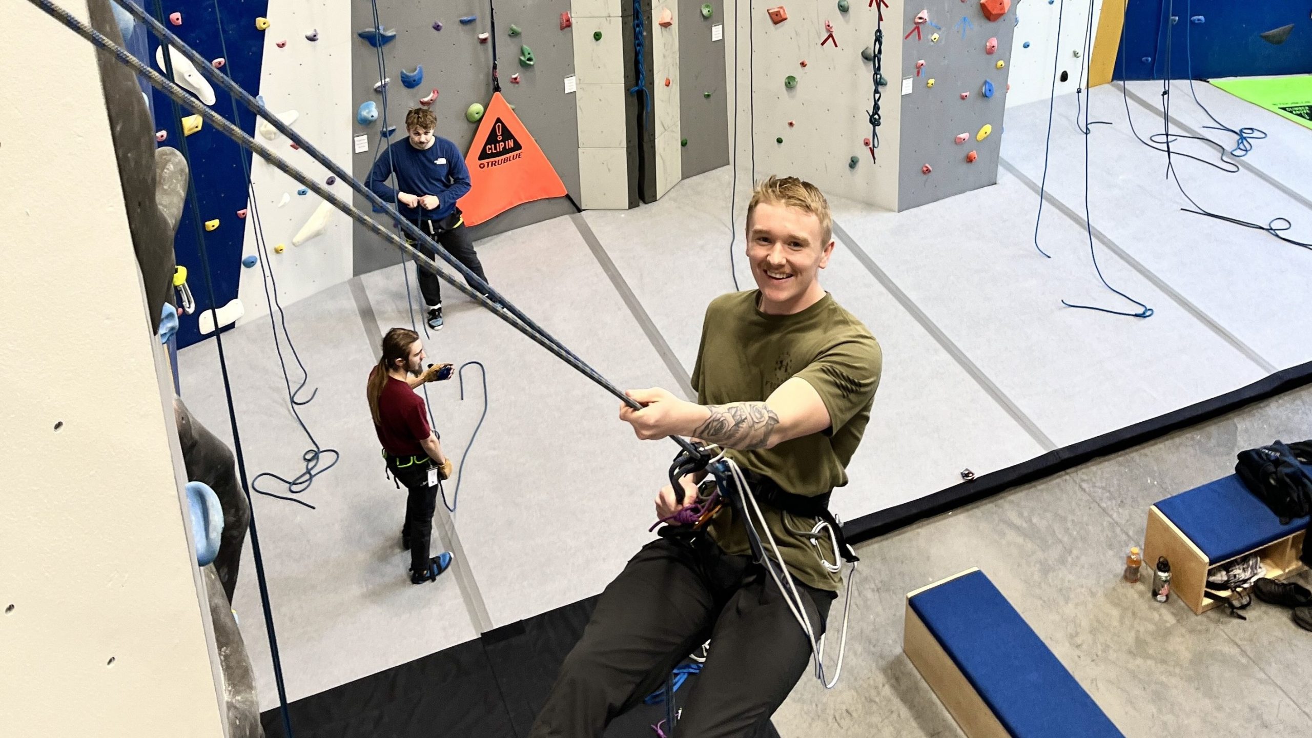 EOU student rappelling from belay ledge at OAP Climbing Center. 