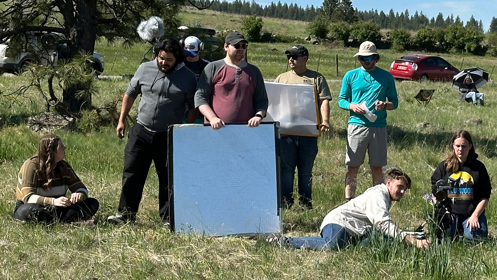 Crew standing on set in a field