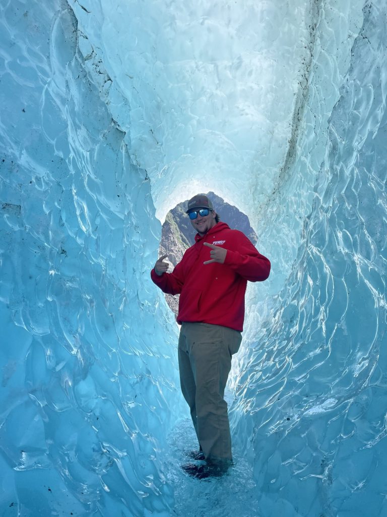 OAP worker Mark inside a glacier in Alaska.
