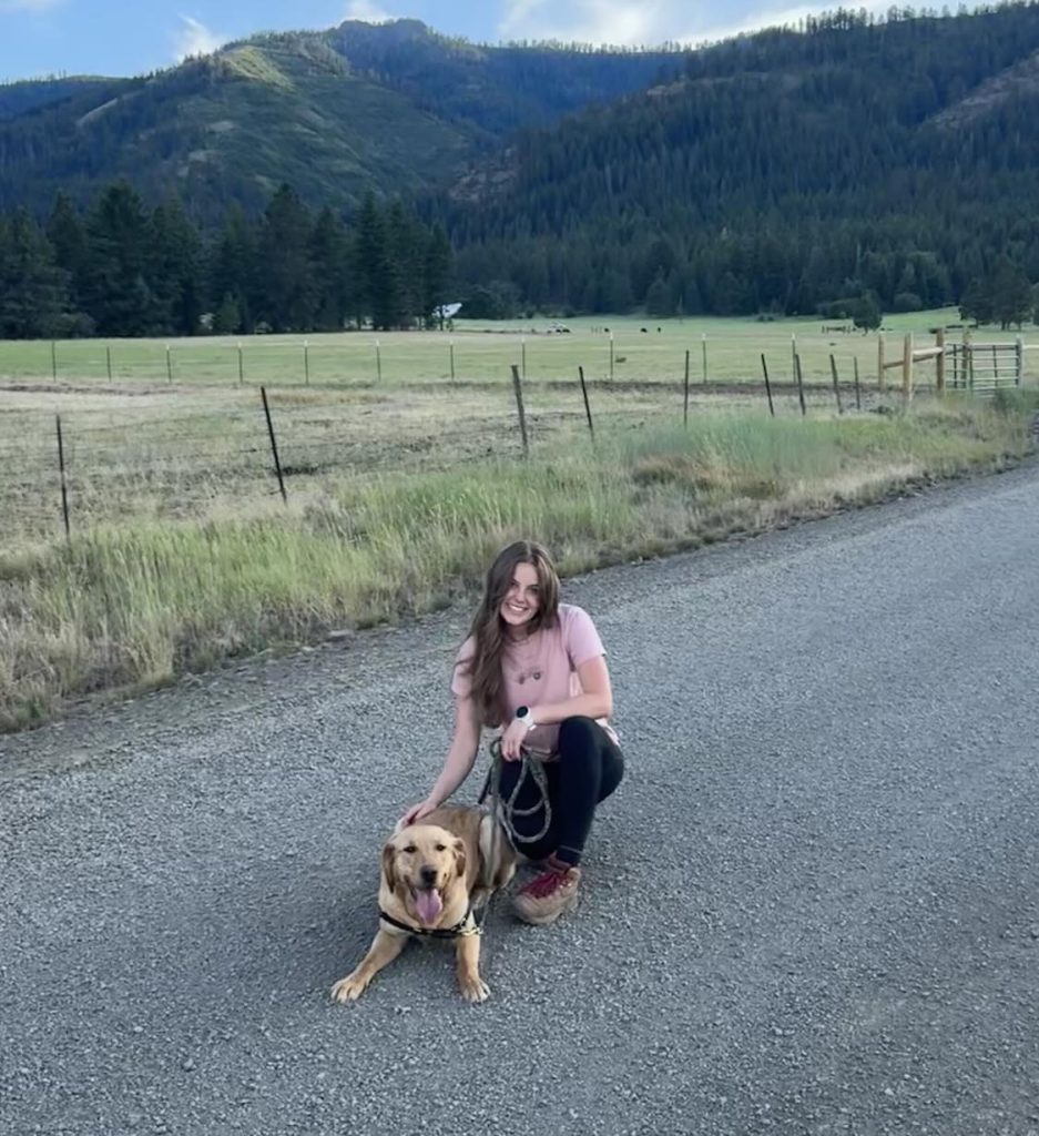 OAP worker Payton posing for a picture with her dog.