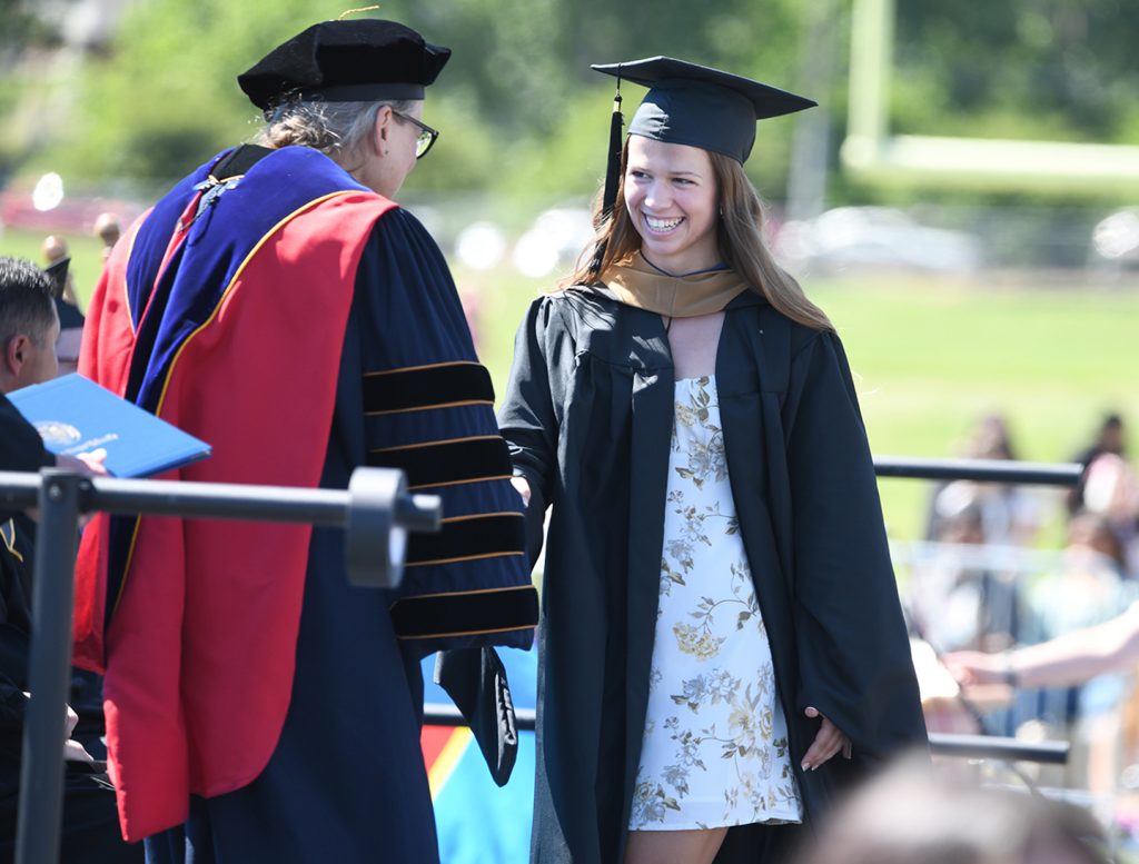 In this picture, Megan Gustafson ‘25 receives her diploma from EOU President Kelly Ryan during the 2025 Commencement ceremonies. (MIchael K. Dakota/ EOU Photograph)