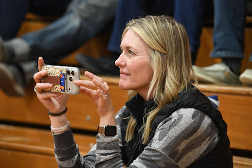 Cassie Moore, ’01, superintendent of Burnt River Charter School, records a performance by the Eastern Oregon University choir during its April tour stop in Unity. (Michael K. Dakota/ Eastern Oregon University)