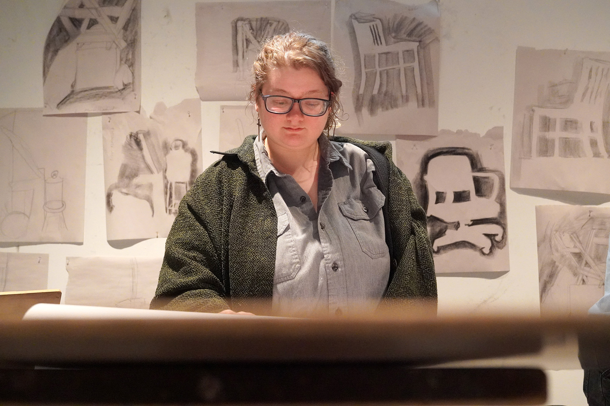 EOU Student working in-studio on drawings